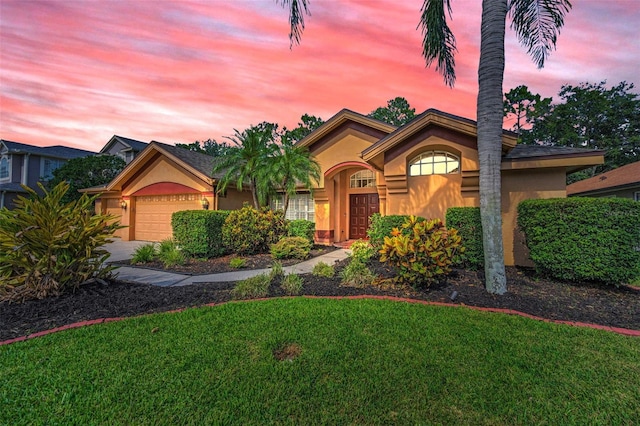 4133 Auston Way, Palm Harbor, FL 34685 - view of front of house featuring stucco siding, a garage, a front lawn, and driveway