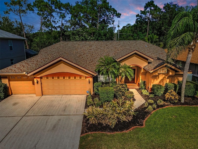 4133 Auston Way, Palm Harbor, FL 34685 - ranch-style house featuring driveway, an attached garage, and stucco siding