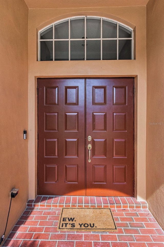 4133 Auston Way, Palm Harbor, FL 34685 - doorway to property with stucco siding