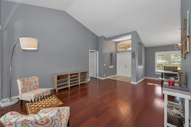 4133 Auston Way, Palm Harbor, FL 34685 - living area with vaulted ceiling, a chandelier, wood finished floors, and baseboards