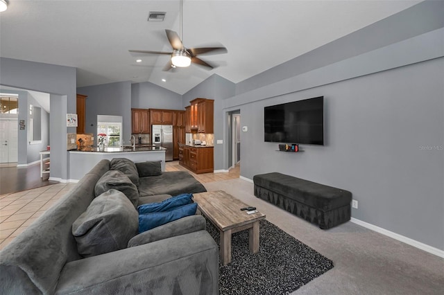 4133 Auston Way, Palm Harbor, FL 34685 - living room with ceiling fan, baseboards, and high vaulted ceiling