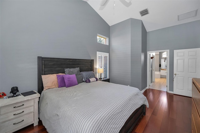 4133 Auston Way, Palm Harbor, FL 34685 - bedroom with high vaulted ceiling, dark wood finished floors, ceiling fan, ensuite bathroom, and baseboards