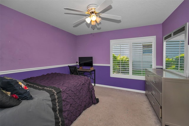 4133 Auston Way, Palm Harbor, FL 34685 - carpeted bedroom with multiple windows, baseboards, a ceiling fan, and a textured ceiling