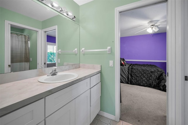 4133 Auston Way, Palm Harbor, FL 34685 - bathroom with vanity, ceiling fan, tile patterned floors, and baseboards