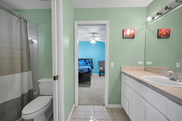 4133 Auston Way, Palm Harbor, FL 34685 - ensuite bathroom featuring vanity, a ceiling fan, baseboards, toilet, and tile patterned floors