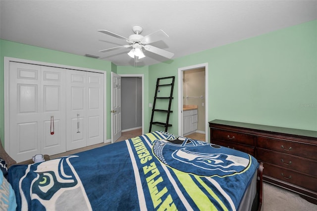 4133 Auston Way, Palm Harbor, FL 34685 - carpeted bedroom featuring a closet, a ceiling fan, baseboards, and ensuite bathroom