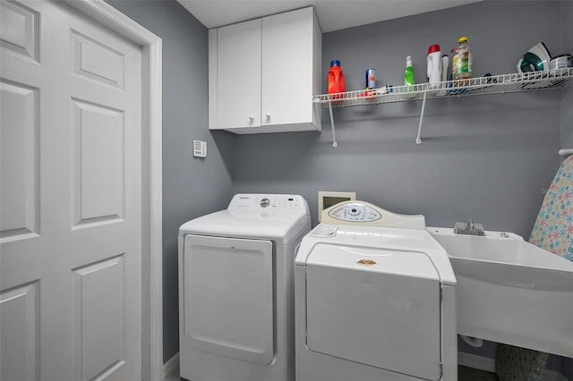 4133 Auston Way, Palm Harbor, FL 34685 - laundry room featuring separate washer and dryer and cabinet space