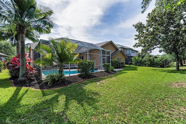 4133 Auston Way, Palm Harbor, FL 34685 - view of green lawn featuring an outdoor pool and a lanai