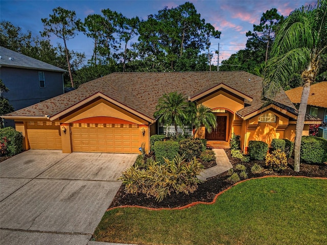 4133 Auston Way, Palm Harbor, FL 34685 - ranch-style house featuring concrete driveway, a garage, stucco siding, and a yard