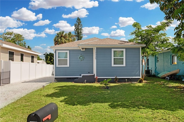 13325 1st St E, Madeira Beach, FL 33708 - rear view of house with a shingled roof, central air condition unit, and crawl space