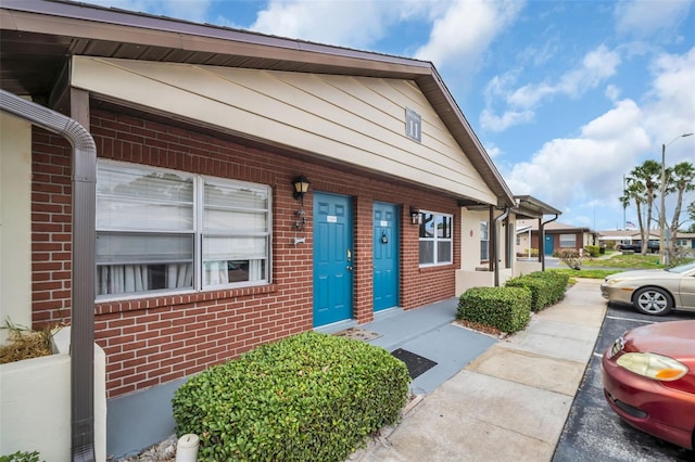 24862 US Highway 19 N Unit 1105, Clearwater, FL 33763 - view of exterior entry with brick siding and a porch
