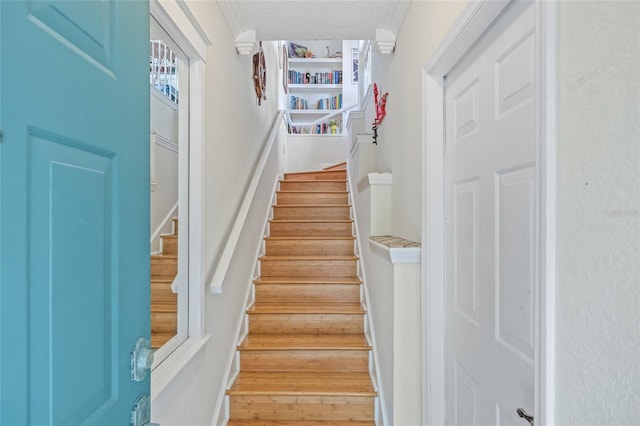 741 Mainsail Dr, Tampa, FL 33602 - stairway with a textured ceiling and wood finished floors
