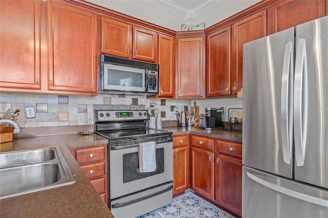 741 Mainsail Dr, Tampa, FL 33602 - kitchen featuring stainless steel appliances, a sink, crown molding, dark countertops, and brown cabinetry