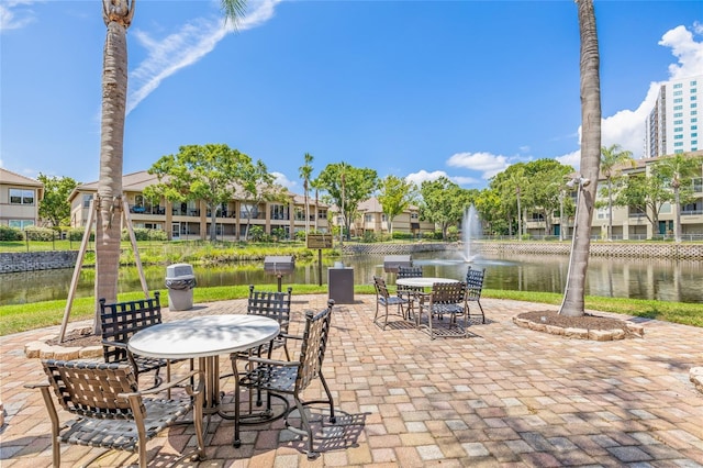 741 Mainsail Dr, Tampa, FL 33602 - view of patio with a water view and outdoor dining space