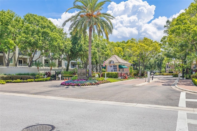 741 Mainsail Dr, Tampa, FL 33602 - view of asphalt road with curbs and a gated entry