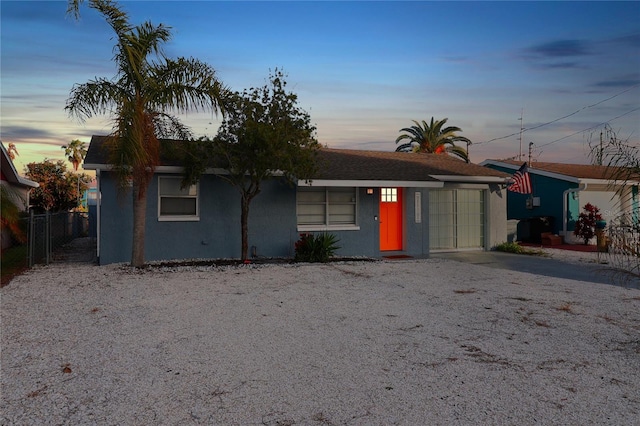 13800 Judy Ave, Hudson, FL 34667 - view of front of house featuring stucco siding and driveway