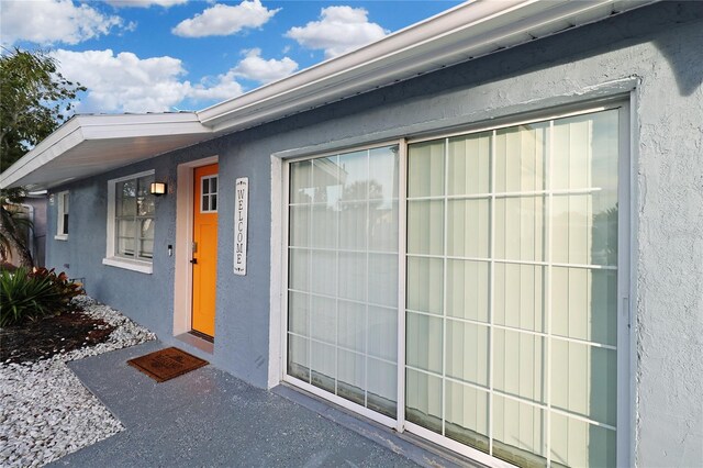 13800 Judy Ave, Hudson, FL 34667 - doorway to property featuring stucco siding