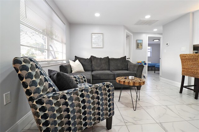 13800 Judy Ave, Hudson, FL 34667 - living area with light marble finish floors, recessed lighting, and baseboards