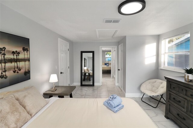 13800 Judy Ave, Hudson, FL 34667 - bedroom with light marble finish floors, attic access, and baseboards