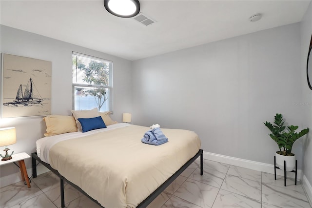13800 Judy Ave, Hudson, FL 34667 - bedroom featuring light marble finish floors and baseboards