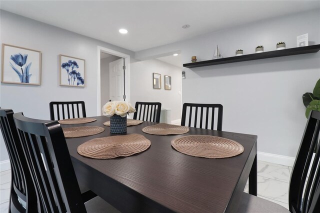 13800 Judy Ave, Hudson, FL 34667 - dining room with recessed lighting, marble look tiles, and baseboards