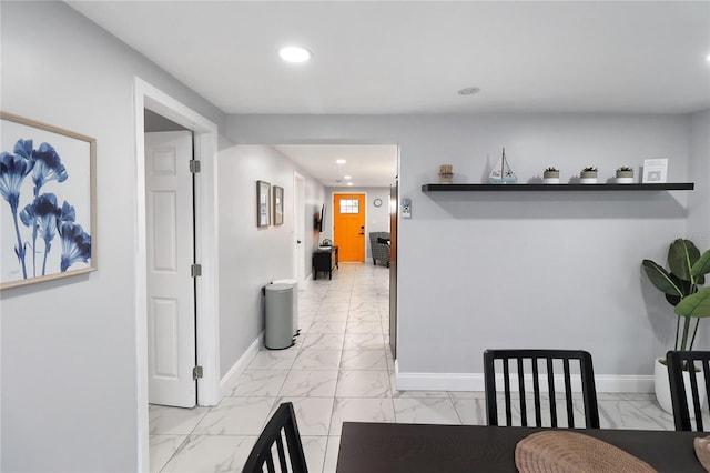13800 Judy Ave, Hudson, FL 34667 - dining area featuring light marble finish floors, recessed lighting, and baseboards