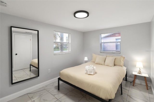 13800 Judy Ave, Hudson, FL 34667 - bedroom with light marble finish flooring and baseboards