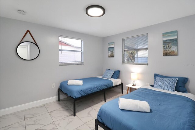 13800 Judy Ave, Hudson, FL 34667 - bedroom with light marble finish flooring and baseboards
