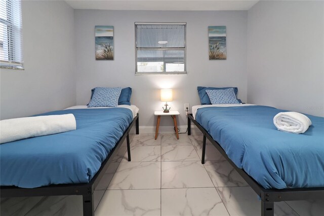 13800 Judy Ave, Hudson, FL 34667 - bedroom with light marble finish flooring and baseboards