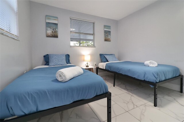 13800 Judy Ave, Hudson, FL 34667 - bedroom with marble look tiles