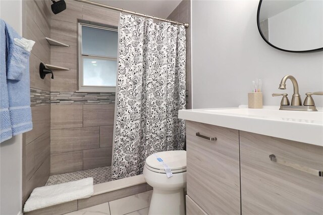 13800 Judy Ave, Hudson, FL 34667 - bathroom with a tile shower, vanity, and toilet