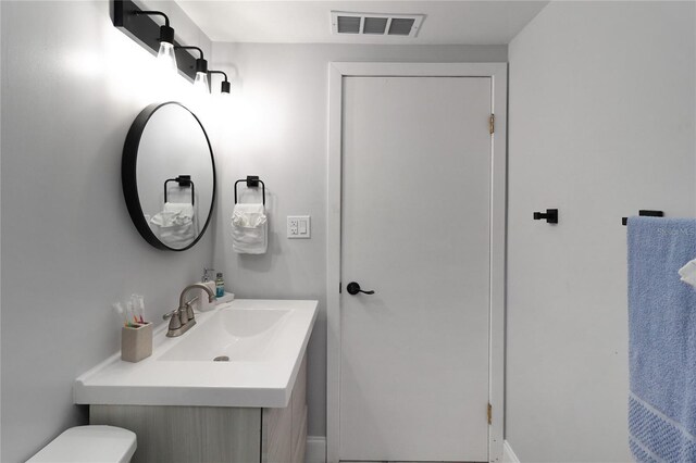 13800 Judy Ave, Hudson, FL 34667 - bathroom featuring toilet and vanity
