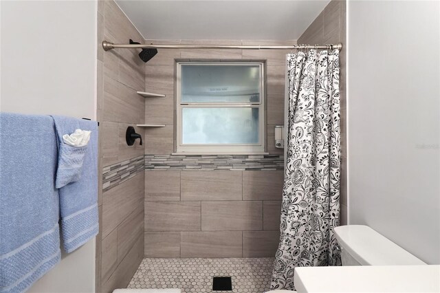13800 Judy Ave, Hudson, FL 34667 - bathroom featuring toilet and tiled shower