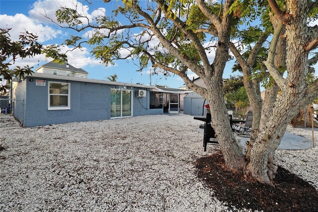 13800 Judy Ave, Hudson, FL 34667 - rear view of house featuring stucco siding and a patio