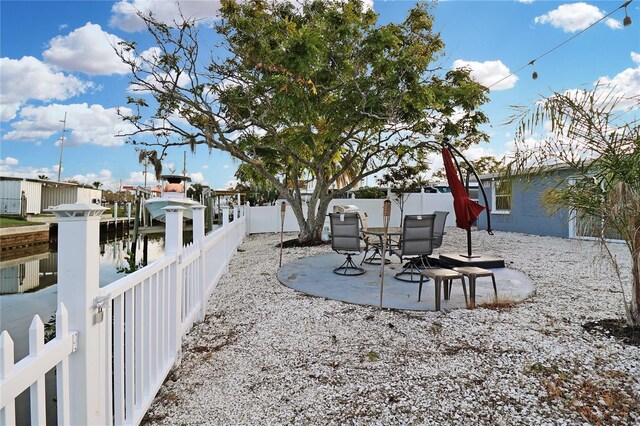 13800 Judy Ave, Hudson, FL 34667 - fenced backyard with a patio and a water view