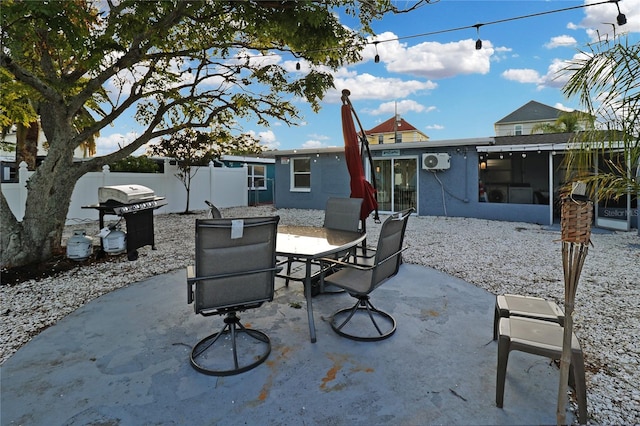 13800 Judy Ave, Hudson, FL 34667 - view of patio featuring a sunroom, a grill, and outdoor dining area