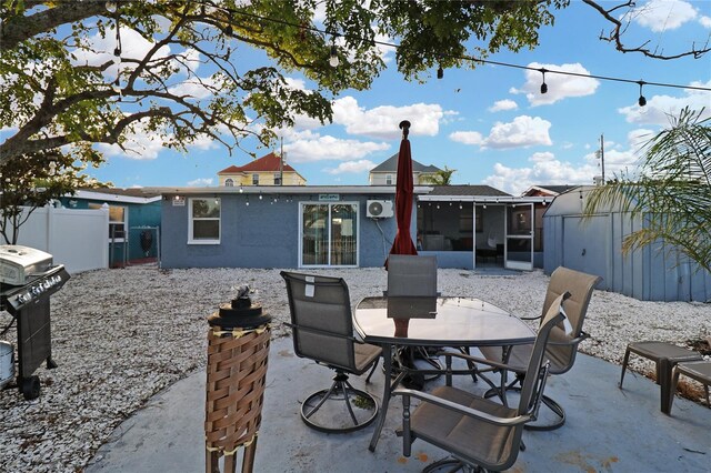 13800 Judy Ave, Hudson, FL 34667 - view of patio with a sunroom and outdoor dining area
