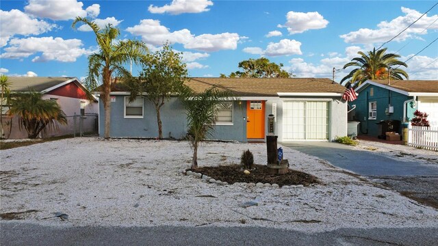 13800 Judy Ave, Hudson, FL 34667 - single story home featuring concrete driveway, stucco siding, and an attached garage