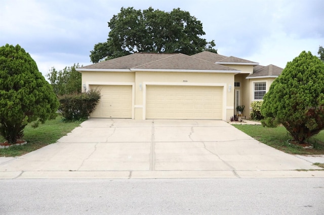 7055 Heatherbrook Dr, Lakeland, FL 33809 - single story home with stucco siding, an attached garage, concrete driveway, and roof with shingles