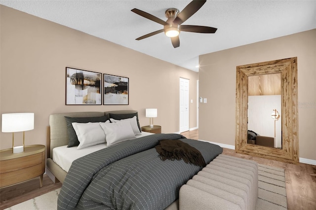 2608 Camille Dr, Palm Harbor, FL 34684 - bedroom featuring wood finished floors, baseboards, and ceiling fan