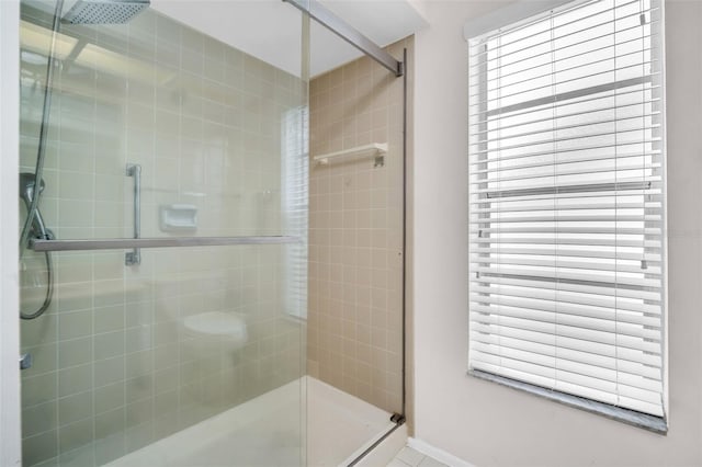 2608 Camille Dr, Palm Harbor, FL 34684 - bathroom with a stall shower and baseboards