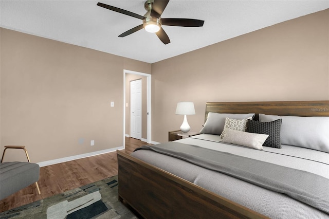 2608 Camille Dr, Palm Harbor, FL 34684 - bedroom featuring wood finished floors, baseboards, and a ceiling fan