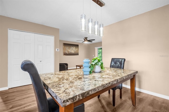 2608 Camille Dr, Palm Harbor, FL 34684 - dining area with wood finished floors, baseboards, and a ceiling fan