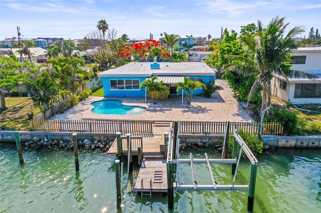 403 Normandy Rd, Madeira Beach, FL 33708 - back of house with boat lift, a fenced backyard, a patio, and a water view