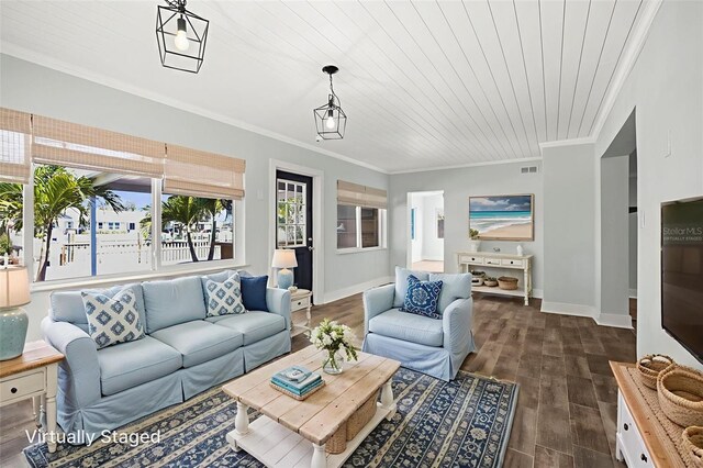 403 Normandy Rd, Madeira Beach, FL 33708 - living area with crown molding, baseboards, and dark wood-style flooring