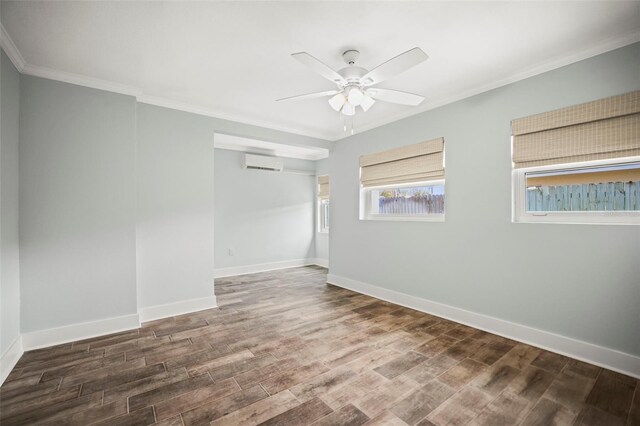 403 Normandy Rd, Madeira Beach, FL 33708 - spare room with a wall unit AC, wood finished floors, ceiling fan, ornamental molding, and baseboards
