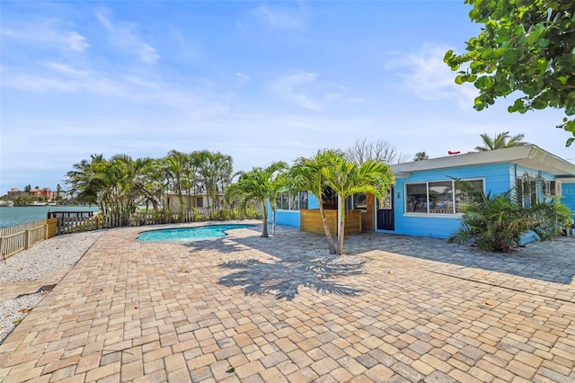 403 Normandy Rd, Madeira Beach, FL 33708 - view of swimming pool featuring a patio area and a water view
