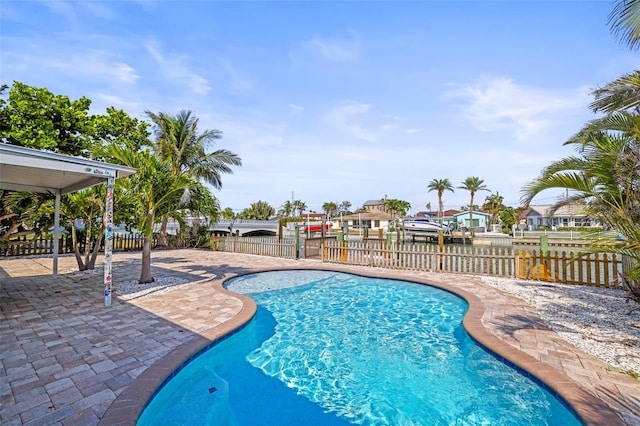 403 Normandy Rd, Madeira Beach, FL 33708 - view of swimming pool featuring a patio area and a residential view