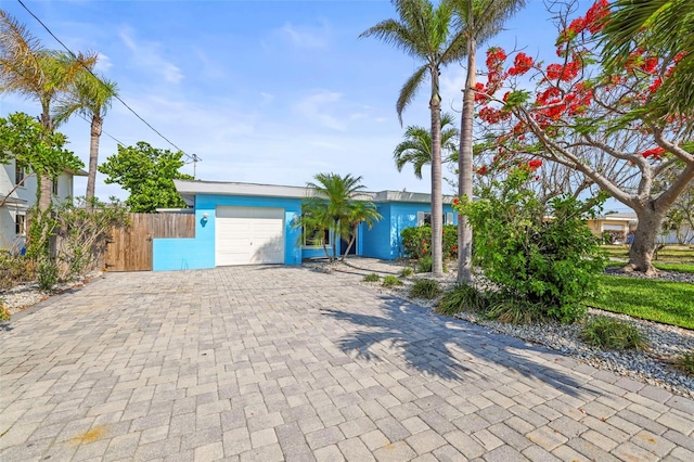 403 Normandy Rd, Madeira Beach, FL 33708 - view of front of home with decorative driveway and an attached garage