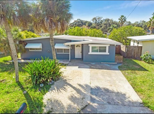 7313 Royal Palm Dr, New Port Richey, FL 34652 - view of front of house featuring driveway and stucco siding